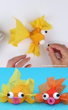 paper fish made out of construction paper and yarn