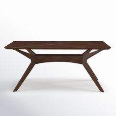 a wooden table sitting on top of a white floor