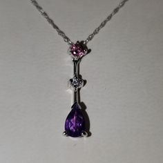 Beautiful Necklace With Pink And Purple! Silver Casting And Chain. All In Original Boxes! Elegant Purple Amethyst Necklace, Formal Purple Gemstone Necklace, Formal Purple Amethyst Necklace, Formal Purple Pendant Necklace, Purple Pendant Necklace For Anniversary, Elegant Purple Pendant Necklace, Elegant Purple Teardrop Pendant Jewelry, Fine Jewelry Purple Teardrop Pendant Necklace, Purple Teardrop Pendant Fine Necklace