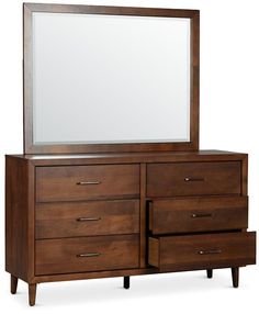 a wooden dresser with a large mirror on it's top and two drawers below