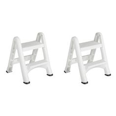 two white plastic step stools sitting next to each other