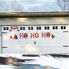 a white garage door decorated with christmas decorations