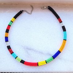 This handmade beaded necklace is made from the highest quality glass seed beads, carefully woven by hand! The vibrantly colored choker necklace fits perfectly on your neck thanks to its stainless steel clip and extension chain! Lenght 15 inches (40 cm) The necklace that you can use in all seasons, compatible with all your clothes, is the ideal handmade gift jewelry for you and your loved ones. Guaranteed to get all the compliments! You can click the link for other handmade jewelry and accessories! https://yasminjewelrygifts.etsy.com Your orders will be shipped the next day. Thank you for supporting and shopping with my small business :) Adjustable Multicolor Beaded Necklaces With Black Beads, Traditional Heishi Beaded Necklaces, Multicolor Beaded Heishi Beads Necklace, Multicolor Heishi Beaded Necklaces With Large Beads, Multicolor Beaded Choker With Round Beads, Multicolor Beaded Heishi Beads Choker, Multicolor Beaded Choker With Heishi Beads, Artisan Multicolor Heishi Beads Necklaces, Artisan Multicolor Heishi Beads Necklace