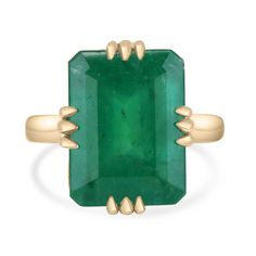 Introducing a bespoke Brazilian emerald vintage-inspired solitaire ring, custom crafted in luxurious 18K yellow gold. This breathtaking piece features an impressive 9.95-carat Brazilian emerald, secured in a unique twelve-prong claw setting that evokes old-world elegance. The gemstone captivates with its grand size and deep forest green hue, exuding a natural, earthy allure. Semi-transparent with minor inclusions visible to the eye, these natural characteristics are a testament to its earth-mine Emerald Solitaire Ring, Solitaire Setting, Claw Setting, Ring Hand, Deep Forest, Semi Transparent, Emerald Ring, Deep Green, Solitaire Ring