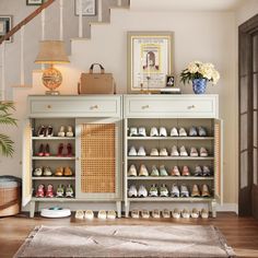 there are many pairs of shoes on the shelf next to the stairs in this room