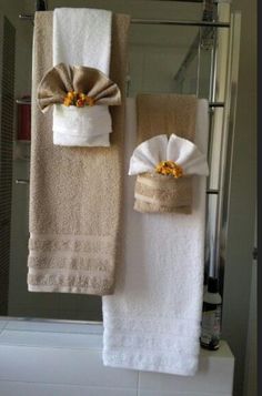 two towels hanging on a towel rack in a bathroom