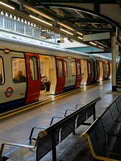 the subway train is stopped at the station for passengers to get on or off it