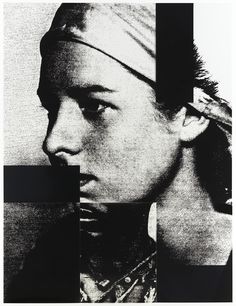 a black and white photo of a man with a bandana on his head, looking at the camera