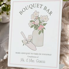 a bouquet bar sign sitting on top of a table