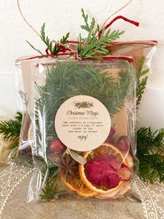 a bag filled with oranges and other christmas decorations