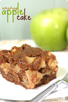 an apple cake sitting on top of a white plate