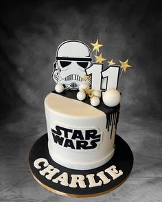 a star wars themed birthday cake with the number one on it and a storm trooper theme