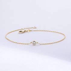 Solitaire Diamond Bracelet in 14K or 18K solid Gold, Bezel Set Dainty Diamond by the Yard Bracelet, Minimalist Bracelet Gift for Women, Graduation Gifts, Gift For Valentine, Gift For Birthday, Gift For Bridesmaid, Wedding Gift For Her ► Adding a customized tiny bar at clasp may be a good idea: https://etsy.me/3cn9OQ5 Material: Solid Gold, real gold (not gold plated or gold filled material) Karat: 14K (585), 18K (750) Gemstone: Genuine Diamond Available diamond options (size mm - weight ct): 1.80 Minimalist 14k Gold Diamond Bracelet With Bezel Setting, Delicate Gold Diamond Bracelet With Bezel Setting, Elegant 14k Gold Bracelet With Birthstone, 14k Gold Bracelet With Bezel Setting, Timeless 14k Gold Bracelets With Bezel Setting, 14k Gold Dainty Bezel Set Bracelet, Timeless 14k Gold Bracelet With Bezel Setting, Classic Gold Bracelet With Birthstone, 14k Yellow Gold Chain Bracelet With Bezel Setting