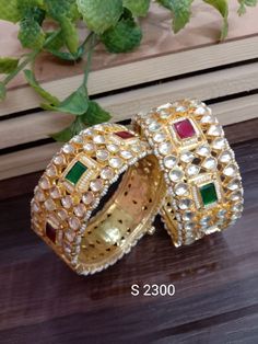 "* Ahmadabadi Kundan bangles. * Handcrafted Gold Plated Kundan bangle Set. * High Quality 22 K Gold Plated- Bangle set. * Sold as a set of 2. Sizes : 2.4 ( 2.30\" diameter of the inner circle) ; 2.6 ( 2.46\" diameter of the inner circle); Gorgeous gold-plated bangle/ bracelet best exemplifies the careful craftsmanship done on it -- a specialty at Nemali Jewelry. It has a special tone of elegance attached to it. The intricate handmade design of the bangle/bracelet set gives it a fresh and origina Fusion Style Bangle For Wedding And Diwali, Festive Fusion Style Ceremonial Bangle, Festive Kundan Fusion Bangle, Ceremonial Kundan Fusion Bangle, Fusion Cutdana Bangle For Diwali, Fusion Style Cutdana Bangle For Diwali, Ceremonial Fusion Kundan Bangle, Fusion Style Meenakari Bangle For Wedding, Fusion Style Cutdana Bangle For Festivals