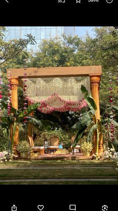 an outdoor wedding setup with flowers and greenery