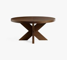 a round wooden table with an x design on the top and two crossed legs, against a white background