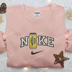 Introducing the Twisted Tea Bottle x Nike Embroidered Hoodie, a perfect fusion of style and comfort. Crafted with premium quality Nike Inspired, Maroon Hoodie, Nike Design, Embroidered Shirts, Limited Edition Shirt, Custom Nike, Shirt Nike, Nike Brand, The Embrace