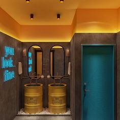 a bathroom with two yellow barrels in it