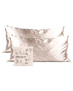 two pillows and a pillow case on a white background with the same product in front