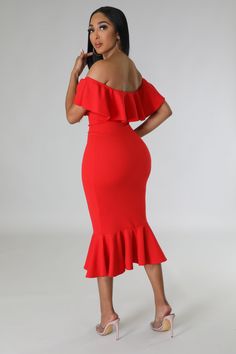 a woman wearing a red dress with ruffles on the bottom and one shoulder