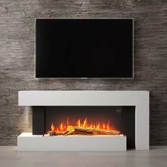 a modern fireplace with a flat screen tv above it and fire burning in the fireplace