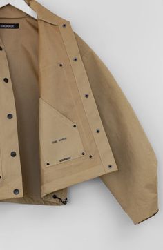 Brown Outerwear With Patch Pockets For Streetwear, Brown Parka With Pockets For Work, Brown Workwear Parka With Pockets, Brown Utility Outerwear With Snap Buttons, Outdoor Brown Utility Jacket With Snap Buttons, Brown Utility Jacket With Snap Buttons For Outdoor, Brown Utility Jacket With Patch Pockets For Streetwear, Utility Beige Outerwear For Streetwear, Beige Outerwear With Patch Pockets For Streetwear