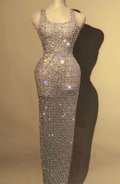 Beautiful Sleeveless Rhinestone Crystal Maxi Dress. Made to Order  Please note this dress is custom made to order. Production time is approve 15-25 days plus shipping. * Sizing - All items are made according to measurement ranges, they are NOT typical letter or numeric sizing. It is imperative to compare your exact measurements with the size chart provided either in the listing photos or item descriptions and to also add your measurements under Personalization. If you have any questions on sizing, please feel free to message me. Do not order your normal size without taking and comparing measurements. * Made to order items such as feather tops, jackets, dresses and rhinestone/crystal dresses are NON-REFUNDABLE/EXCHANGEABLE. If you have a problem with your order, please contact me and I will Fancy Christmas Party, Silver Glitter Dress, Stone Dress, Crystal Dress, Feather Tops, Velvet Maxi Dress, Thousand Oaks, Rhinestone Dress, Glitter Dress