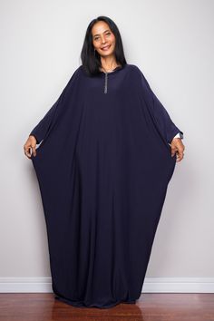 "Navy Blue Kaftan Dress, Maxi Dress, Long boho dress, Loose fit dress, Modest dress, Dark Blue kaftan with pockets PRODUCT SIZE : One Size Fits Most * Chest : free up to 58\" * Waist : free up to 58\" * Hips : free up to 58\" * Circumference bottom hem : 45\" * Length : 56\" * Sleeve length : 23\" MATERIAL * Spandex Venetia * Zipper on the back MODEL : * Model chest : 32\", Height 160 cm (5.2) without high heel * Accessories excluded Produced by NUICHAN IMPORTANT NOTE *Please note that colours s Elegant Blue Tunic Maxi Dress, Bohemian Blue Maxi Abaya, Blue Tunic Abaya For Summer, Blue Maxi Length Abaya For The Beach, Summer Blue Tunic Abaya, Blue Long Sleeve Summer Thobe, Blue Tunic Abaya For The Beach, Blue Tunic Abaya For Beach, Blue Long Abaya For The Beach