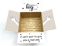 the inside of a cardboard box that says, sending a hug from a safe distance