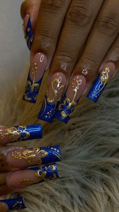 Nail Art Designs Royal Blue, Christmas Nails Blue And Gold, Blue N Gold Nails, Dark Blue And Gold Nail Designs, Blue & Gold Nails, Blue Gold Nails Ideas, Royal Blue And Gold Prom Nails, Blue And Gold Prom Couple, Nails Royal Blue And Gold