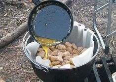 a person pouring something into a bucket filled with rocks