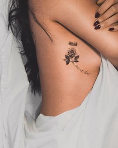 a woman with a rose tattoo on her chest