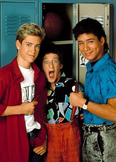 three young men standing next to each other in front of lockers with their mouths open