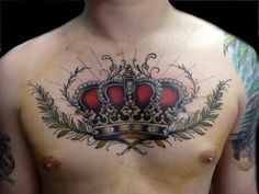 a man with a crown tattoo on his chest