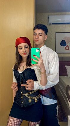 a man and woman dressed up in costumes