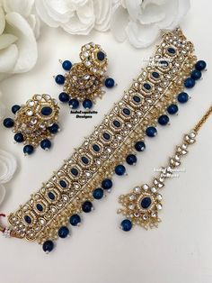 Gorgeous Kundan Choker comes with Jhumki Earrings and Tikka/ Indian Jewelry/Unique Polki and Kundan Jewelry/Navy blue   All items are shipped from Brampton, Ontario, Canada. If you need your item by a certain day, please reach out to us for express delivery option before placing the order so that we can update the shipping for you. Standard shipping/delivery timeline Below are the delivery timeline estimates. We dispatch all orders by the next business day. ---> USA delivery timeline * 3-5 busin Heavy Blue Chandbali Jewelry Sets, Heavy Blue Bridal Necklace For Diwali, Blue Jewelry Sets With Stone Work For Wedding, Blue Stone Work Jewelry Sets For Wedding, Heavy Blue Jewelry Sets For Festivals, Heavy Blue Jewelry Sets For Wedding, Blue Heavy Jewelry For Wedding, Blue Jewelry Sets For Wedding And Festivals, Heavy Blue Jewelry For Wedding