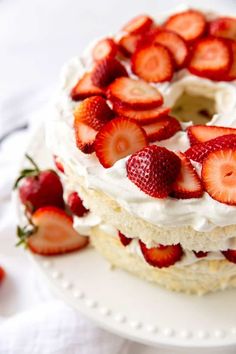 there is a cake with strawberries on it