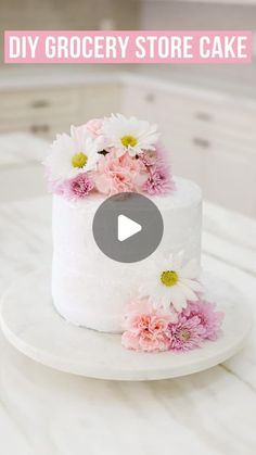 393K views · 20K likes | Brittany | Home Decor & Style on Instagram: "How to transform a grocery store cake when you’re in a pinch or on a budget 🌸💜💕

STEP 1: Freeze your cake! Remove the color frosting when it’s frozen. This avoids all the colors from spreading and as the frosting thaws, you can smooth it all out.

STEP 2: Garnish with flowers. Be sure to rinse and dry florals before adding to cake. I also like to wrap the stems in plastic wrap. This acts a a vase for the flowers, keeps all the water and moisture in the stem.

Give this DIY cake a try for your next birthday party, baby shower, bridal shower or even for Easter!🐣 

For reference, I got the florals and cake from @frysfoodstores a @krogerco family store! 

#birthdaycakeideas #babyshowerideas #bridalshowerideas #diycake #c Grocery Store Cake, Color Frosting, Pie Crust Recipe Easy, Cake Tips, 4th Of July Cake, Icing Frosting, Quick Easy Desserts, 50th Birthday Cake, Funfetti Cake