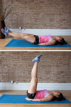 a woman is doing an exercise on a blue mat in front of a brick wall