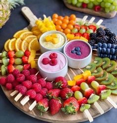 various fruits and dips arranged on a platter