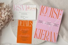 the wedding stationery is laid out on a plate