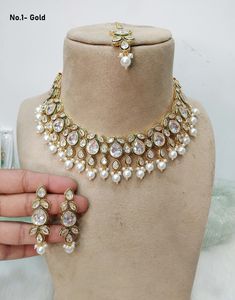 *Light Weight Kundan necklace set with earrings and tikka. *Studded with kundan stone. *Light Weight Gold kundan necklace. No.1-  *Necklace width- 1.6 inches (included pearl drop) *Earrings Length- 2.2 inches(included pearl drop) *Earrings width- 0.6 inches No.2-  *Necklace width- 0.9 inches (included pearl drop) *Earrings Length- 2.5 inches(included pearl drop) *Earrings width- 0.9 inches No.3-  *Necklace width- 1.1 inches (included pearl drop) *Earrings Length- 1.9 inches(included pearl drop) White Kundan Necklace, Gold Kundan Necklace, Necklace Set With Earrings, Kundan Necklace Set, Necklace Set Indian, 2 Necklace, White Saree, Kundan Necklace, Kundan Necklaces