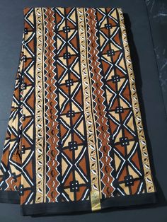 DESCRIPTION Brown, Beige and Black Tribal Ankara Fabric. This is high quality African print is 100% cotton and it's 45 inches wide. It is used for making African Clothing, African quilts, & For Home decoration. FYI: Print is Double sided. The listing is for Per yard, 6yards and Headwrap For Each piece of fabric measures: 34-36in by 45in for 1yard 105-108in by 45in for 3yards 210-216in by 45in for 6yards 70in by 22in for Head wrap If you purchase more than one yard, you will receive one continuous piece. *If you require more than what I have listed, feel free to send me email. CARE INSTRUCTIONS:•DO NOT BLEACH•Hand wash with cold water and mild soap or Dry clean•Press with warm iron on the wrong side only. Color may be different due to your monitor African Quilts, Clean And Press, Head Wrap Headband, African Ankara, Beige And Black, Girls Quilts, African Print Fabric, Ankara Fabric, Mixing Fabrics