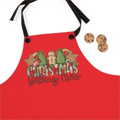 a red apron with cookies on it and the words christmas baking crew