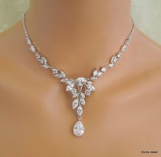 This beautiful cubic zirconia set comes with necklace and earrings.   This crystal jewelry set comes with necklace and earrings. It has the perfect amount of sparkle for your Old Hollywood Glam, vintage wedding, formal event, special occasion. Necklace is available from 14" to 22" long.  Focal point measures approximately 5 3/4" wide by 2 1/4" long including the teardrop.  Finished with rhodium plated chain and a lobster claw closure. It comes with a 2" extender chain for additional length. Chandelier earrings are about 1 7/8" long from top to bottom.  Perfect for a classy bride or any special occasion! Necklace can be extended up to 18" long without extra charge if specified at the time of ordering. Matching bracelet, https://www.etsy.com/listing/644578685/crystal-bracelet-cubic-zirconia- Statement Necklace Wedding, Bridal Earrings Studs, Bridal Earrings Chandelier, Bridal Necklace Set, Old Hollywood Glam, Crystal Jewelry Sets, Wedding Formal, Hollywood Glam, Wedding Jewelry Sets