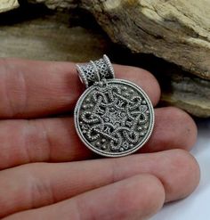 Sterling silver replica of a viking pendant from Birka, Sweden. Bring historical Viking style to your wardrobe with this authentic Birka Viking pendant replica. Crafted from sterling silver, this pendant features intricate filigree and granulation details, representing the impeccable craftsmanship and attention to detail of Viking jewelry. This pendant comes with a silver chain and is perfect for adding a bold statement to any outfit. Whether you're a history buff or a lover of unique jewelry, t Norse Necklace, Ancient Greek Jewelry, Vikings Gifts, Talisman Jewelry, Viking Pendant, Medieval Jewelry, Bronze Jewelry, Greek Jewelry, Ancient Jewelry