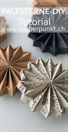 an origami flower made out of sheet music notes is featured in the book pattern - diy