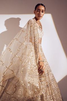 Ivory attached soft can-can lehenga featuring 3D and sequin embroidery all over. Paired with a padded embroidered blouse and a sheer embroidered hem dupatta. - Aza Fashions Wedding Lehenga In Off White With Cutdana, Off White Lehenga For Wedding And Diwali, Ceremonial Lehenga With Sheer Dupatta, Lehenga With Sheer Dupatta For Ceremonies, Ceremony Lehenga With Sheer Dupatta, Diwali Ceremony Lehenga With Dupatta, Gold Lehenga With Sheer Dupatta For Ceremony, Reception Lehenga In Off White With Sheer Dupatta, Off White Lehenga With Sheer Dupatta For Reception