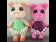 two crocheted stuffed animals sitting next to each other