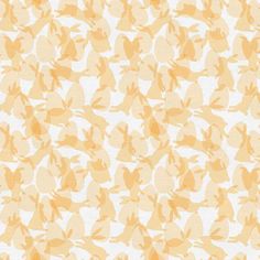 an orange and white background with small leaves on the bottom half of it, in shades of yellow